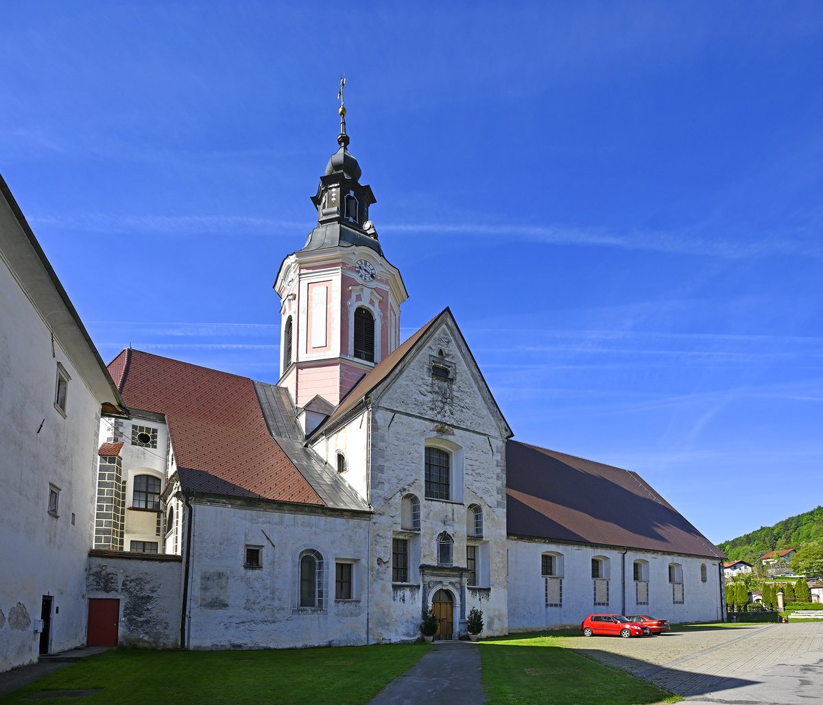 Ancient Cistercian monastery in green valley with historic architecture